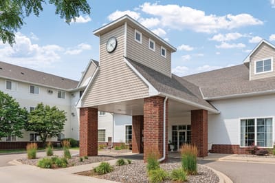 Exterior view of the facility entrance showing clock tower