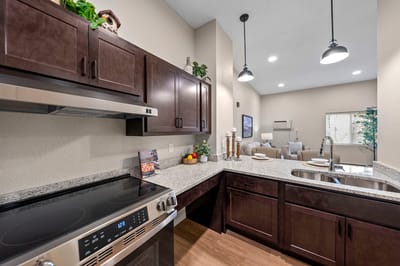 Modern kitchen interior with granite countertops and appliances