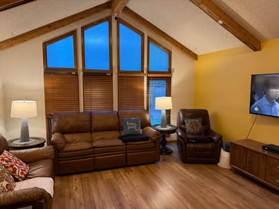 Cozy interior living area with large windows and seating