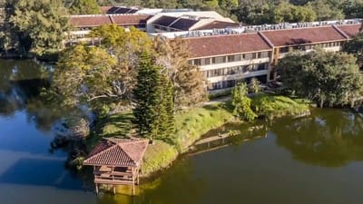 Aerial view of the facility by a lake