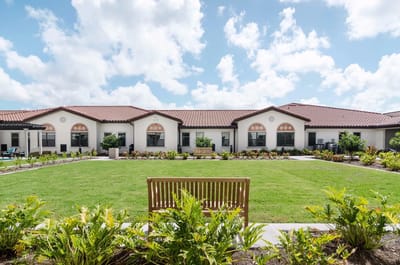 Outdoor courtyard with landscaped gardens and seating