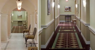 Interior hallway with decorative carpet and seating