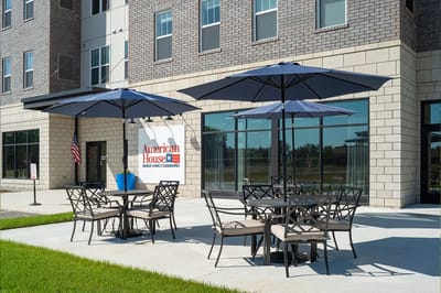 Outdoor seating area with umbrellas outside the facility