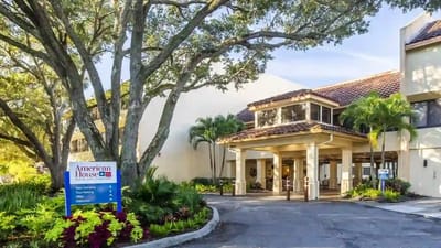 Exterior view of American House Sarasota with landscaping