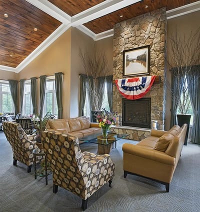 Interior common area with cozy seating and a fireplace