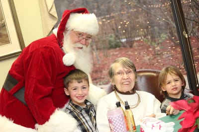 Residents with Santa Claus during a holiday celebration