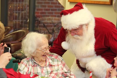Resident enjoying a visit from Santa Claus
