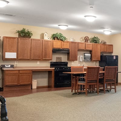 Interior kitchen area with wooden cabinets and dining table