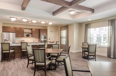 Dining area with modern furniture and large windows