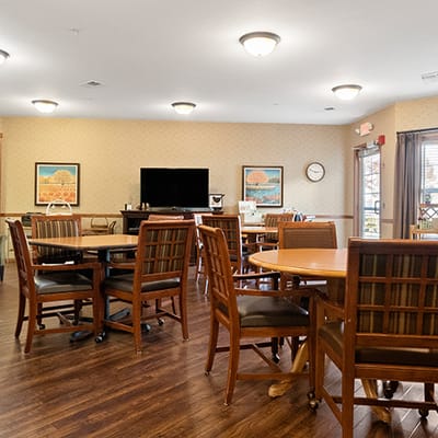 Bright common area with tables and chairs