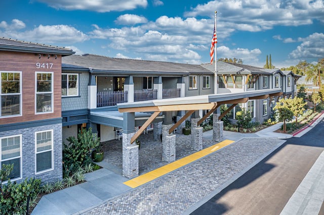 Exterior view of Allara Senior Living facility with landscaped entrance