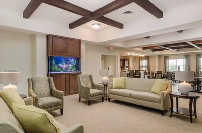 Interior common area with seating and aquarium.