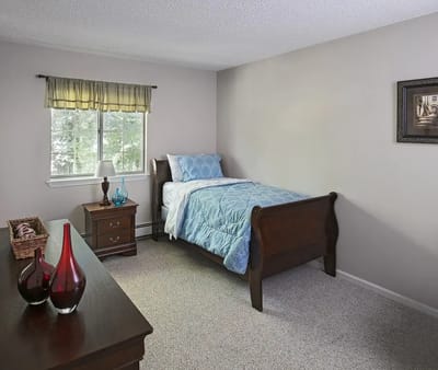 Cozy private bedroom with a bed and window