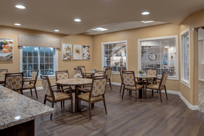Bright dining room with tables set for meals