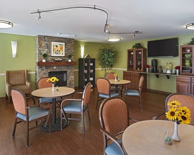 Bright common area with tables and sunflowers