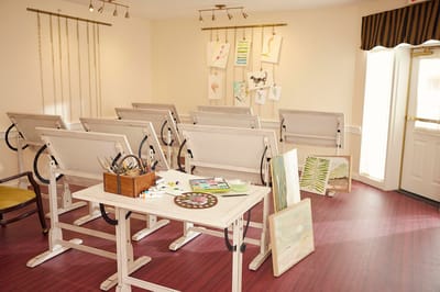 Art activity room with easels and supplies