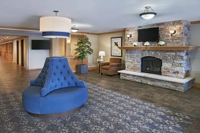 Cozy lobby with a fireplace and seating area