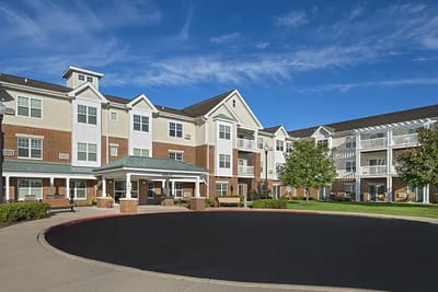 Exterior of American House Cedarlake with landscaped grounds