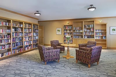Cozy reading nook with bookshelves and seating