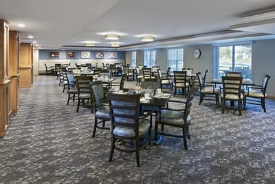 Dining room setup with tables and chairs