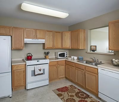 Modern kitchen with wooden cabinets and appliances