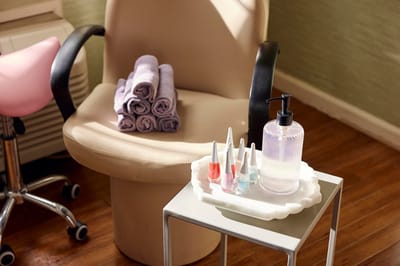 Salon setting with nail polish and towels