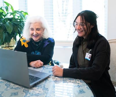 Resident and staff member enjoying a video call