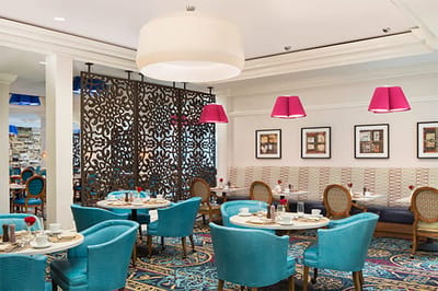 Bright dining area with vibrant decor and seating
