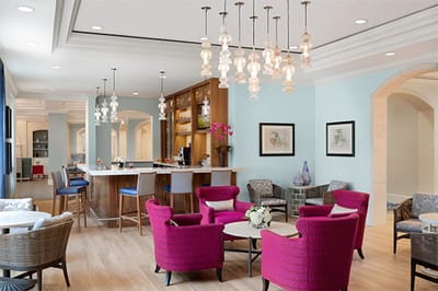 Bright common area with modern furniture and bar