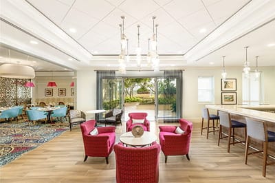 Bright common area with seating and outdoor view