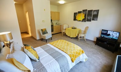 A cozy resident room with modern decor and furnishings