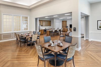 Bright dining area with tables and chairs