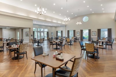 Spacious dining room with tables and chairs