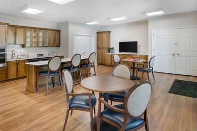 Bright common area with kitchen and seating