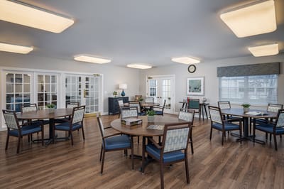 Bright common area with tables and chairs