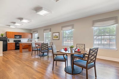 Bright common area with tables and chairs