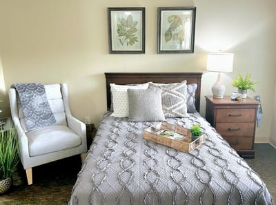 Cozy resident room with bed and decor