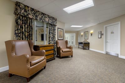 Interior hallway with seating area and decor