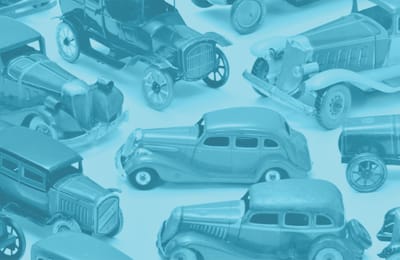 Colorful toy cars arranged on a flat surface