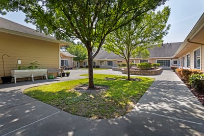 Well-maintained courtyard with trees and pathways