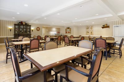 Interior view of a dining room with tables and chairs