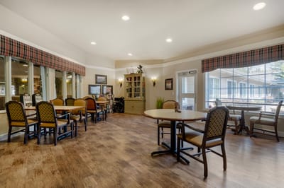 Bright and inviting common area with tables and chairs