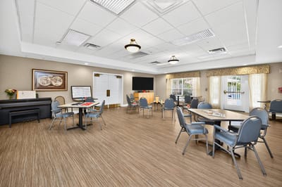 Bright common area with tables and chairs