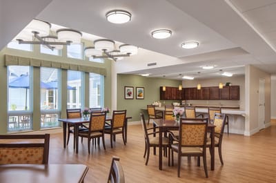 Bright dining area with wooden tables and chairs