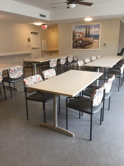 Bright common area with tables and chairs
