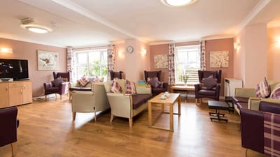 Bright common area with seating and natural light