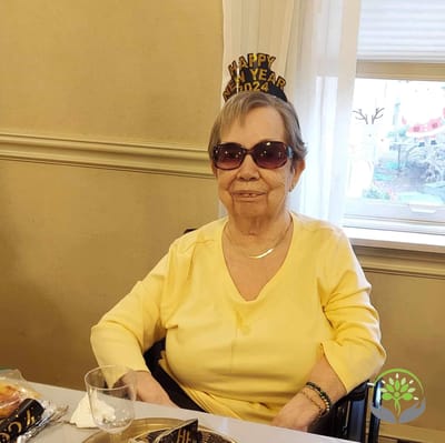 Resident celebrating New Year's with festive hat