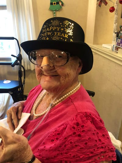 Resident celebrating New Year with a festive hat