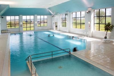 Indoor swimming pool with residents swimming