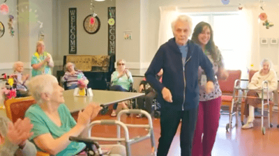 Residents enjoying a dance activity in a common area
